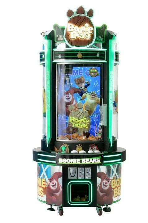 A video game machine that is green and has a picture of woody.