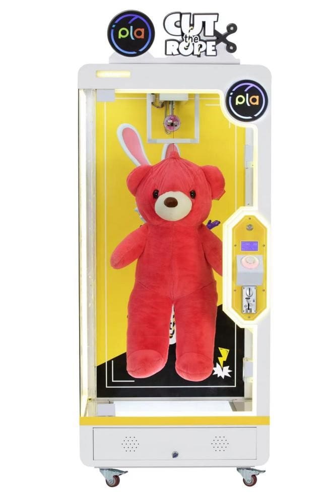 A red teddy bear with bunny ears in its box.